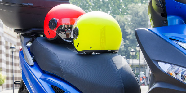 Storing a helmet in a scooter compartment